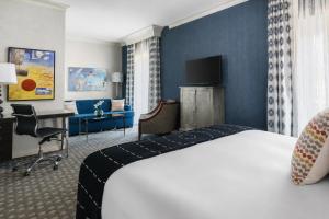 a hotel room with a bed and a desk at The Marker Union Square San Francisco in San Francisco