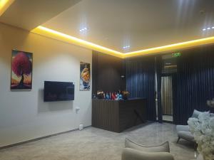 a lobby with a reception desk in a building at Baxt Hotel&Hostel in Andijan