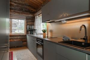 a kitchen with a sink and a counter top at Holiday Home Ruka Etelärinne 10 B in Ruka
