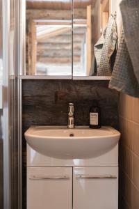 a bathroom with a sink and a mirror at Holiday Home Ruka Etelärinne 10 B in Ruka