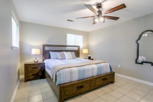 a bedroom with a bed and a ceiling fan at Tiger Town Retreat: Spacious 3-Home Retreat! in Baton Rouge