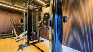 a fitness room with a gym with tread machines at W Tambaú Apart Hotel in João Pessoa