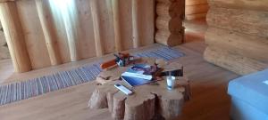 a wooden room with a table with a laptop on it at Rönk Villa Demjèn in Demjén