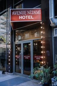 a hotel with a sign that reads avenue nikoma hotel at Avenue Nizami hotel in Baku