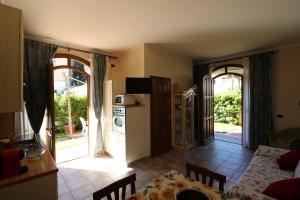 a kitchen with an open door to a living room at Casamare Gianluca da 1 a 5 posti letto in Marina di Massa