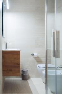 a bathroom with a toilet and a sink and a shower at B&B Alba in Celano