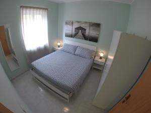A bed or beds in a room at Casa Vacanze Domus