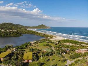an aerial view of a beach and the ocean at Morada do rosa ouvidor in Garopaba