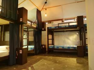 a room with two bunk beds in it at Way of The Bay in Arugam Bay