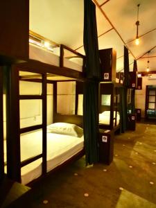 a group of bunk beds in a room at Way of The Bay in Arugam Bay