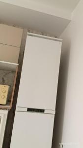 a white refrigerator in a room with a ceiling at Chalet Dar Well-Ness in Dar Mohammed Salah