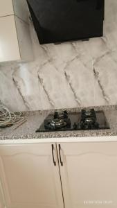 a kitchen counter with a stove top in a kitchen at Chalet Dar Well-Ness in Dar Mohammed Salah