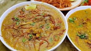 a bowl of soup with meat and vegetables on a table at Ibrahim lodge restaurant in Astor +5 photos