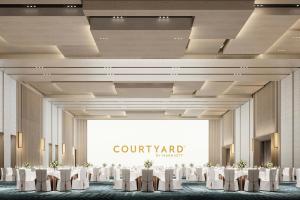 a rendering of a banquet hall with tables and chairs at Courtyard by Marriott Rizhao in Rizhao