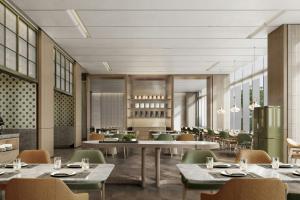 a rendering of a restaurant with tables and chairs at Courtyard by Marriott Rizhao in Rizhao
