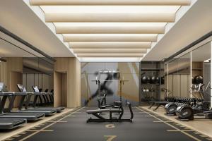 a gym with treadmills and elliptical machines at Courtyard by Marriott Rizhao in Rizhao
