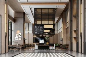 a lobby with tables and chairs in a building at Four Points by Sheraton Fuzhou Changle in Fuzhou