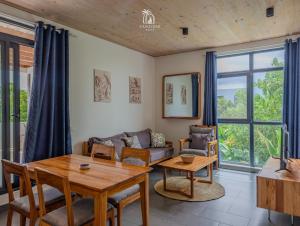 a living room with a table and a couch at Zanzibar Stays Accommodation Collection, The Soul, Paje in Paje