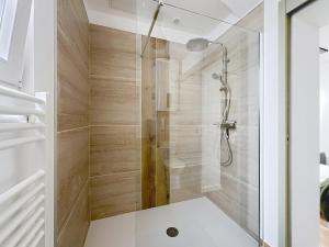 a shower with a glass door in a bathroom at Le Cosy Garibaldi in Sotteville-lès-Rouen