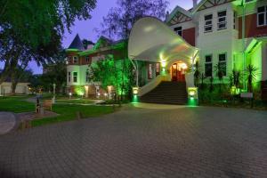 a large white house with a glass dome on it at Holiday Inn - Johannesburg Sunnyside Park by IHG in Johannesburg