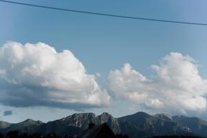 a view of mountains with clouds in the sky at Willa Madejówka - Apartamenty z Widokiem na Góry i Wanną z Jacuzzi in Ząb