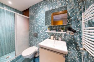a bathroom with a sink and a toilet and a mirror at The King Suit Beşiktaş in Istanbul +37 photos