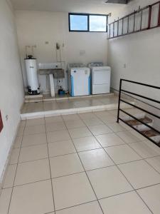 a room with two washers and two washers at Departamentos MIRAMONTES in Guaymas