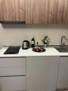 a kitchen with a plate of fruit on a counter at Vista Studio in Bakuriani