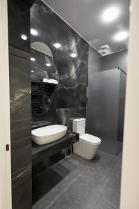 a bathroom with a sink and a toilet at Lchak Hotel in Yeghegnadzor +24 photos