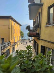 a view of a street between two buildings at Studio apartment on the lake in Lovere