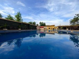 a large swimming pool with blue water at Ivy Hotel Lagos Ikeja in Hausa