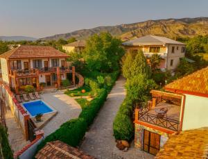 an aerial view of a house with a swimming pool at Merebashvili Estate in Kaspi