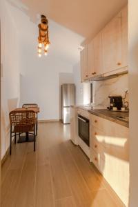 a kitchen with a counter and a table in it at Casa del mare in Pyrgos
