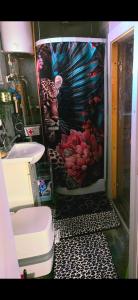 a bathroom with a toilet and a sink and a counter at DAGNA summer house in Šunupis +25 photos