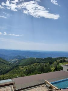 a view from the roof of a house with a swimming pool at Milmari Kopaonik in Kopaonik