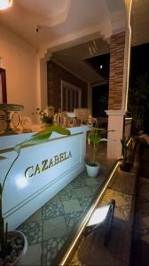 a house with a sign that says cazenda at Cazabela in Casisang