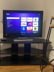 a flat screen tv sitting on top of a table at The Nest Chelmsford in Chelmsford