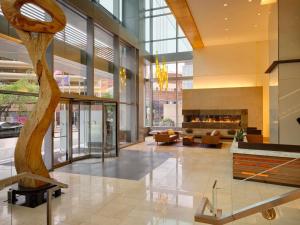 a lobby with a tree in the middle of a building at Fairmont Pittsburgh in Pittsburgh