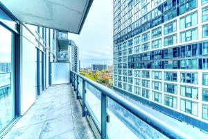a balcony with a view of a building at Filmos Hotel and Suites in Toronto