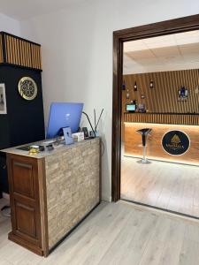an office with a desk with a laptop on it at B&B Valhalla in Paola