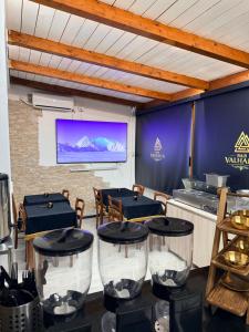 a conference room with tables and a projection screen at B&B Valhalla in Paola