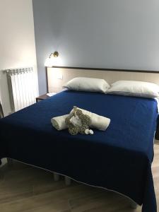 Ένα ή περισσότερα κρεβάτια σε δωμάτιο στο Residenza Murat
