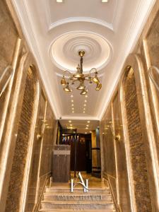 a lobby of ankin hotel with a chandelier at Amin Hotel Cairo Downtown in Cairo