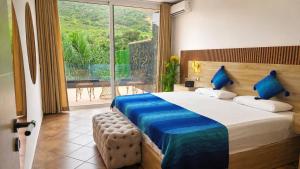 a bedroom with a large bed and a large window at Villa privé Tetouan avec piscine in Tétouan +62 photos