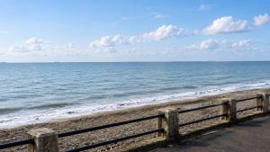 a view of the ocean from the beach at Sea-View Luxury Apartment sleeps 5 - Pet Friendly - Fast WiFi - Off Street Parking - Contractors Dream!!! in Sheerness