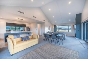a living room with a couch and a table at 31 on Boundary in Twizel