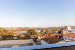 a view of a city from the roof of a building at Lagoa Suítes in Lagoa Santa +8 photos