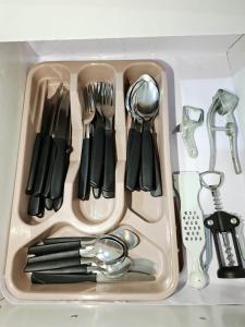 a tray filled with utensils in a refrigerator at Studio Cataratas com garagem e ar condicionado in Foz do Iguaçu