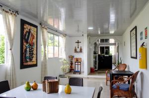 a dining room with a table and chairs at HOTEL BOUTIQUE SONNE BALOP Valledupar in Valledupar