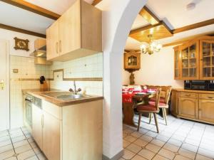 a kitchen with a sink and a table at Landhaus Rangersdorf in Rangersdorf